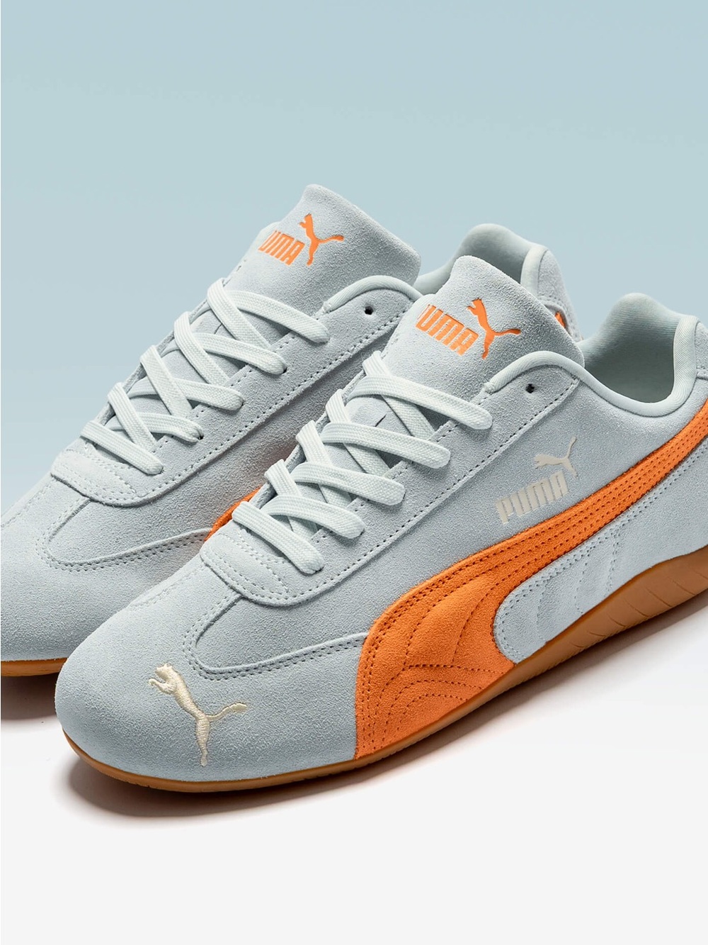 Puma Light Blue and Orange Suede Sneakers
